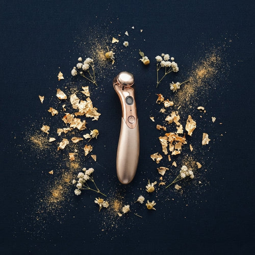 Velvoria 4-in-1 Radiance Eye Renewal Wand flat lay — navy and gold